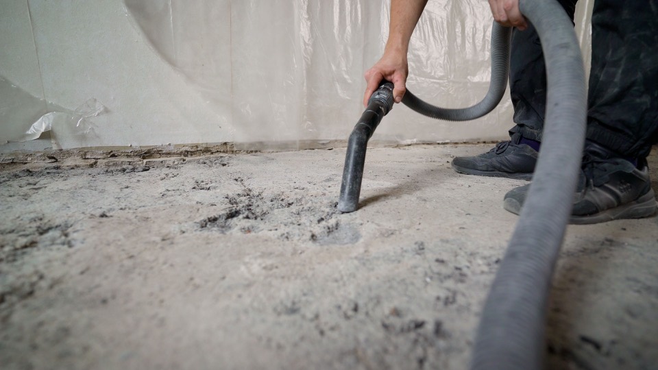 Vacuuming dust during post-renovation cleanup