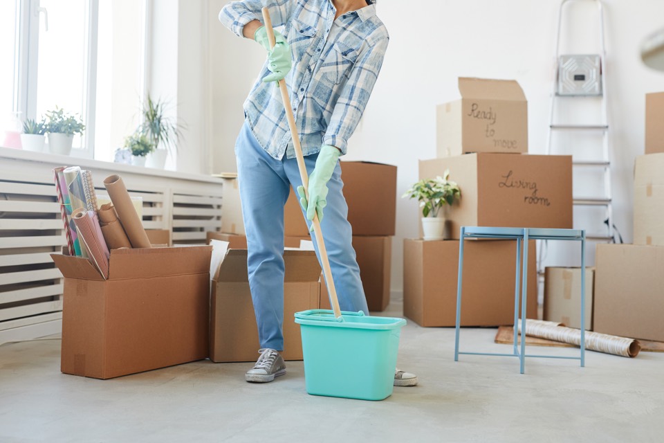 Mopping floors during move-in and move-out cleaning